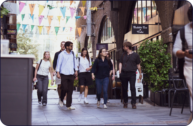 digitalRG team walking together under colourful bunting